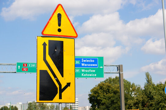 Closeup Shot Of Yellow Road Warning Signs On A Blue Sky Background