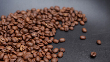 a path of coffee beans on a black background