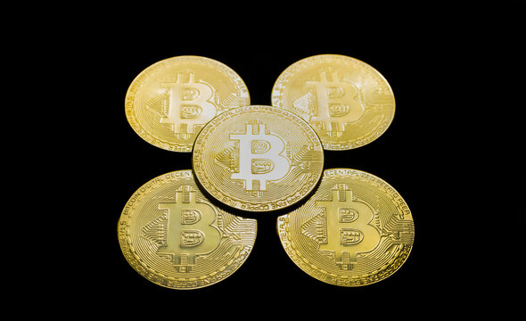 Bitcoin BTC crypto currency gold coins on black background, new virtual money concept. Mining or blockchain technology
