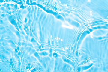 Transparent blue colored clear water surface texture with splashes. Trendy abstract nature...