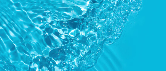 Transparent blue colored clear water surface texture with ripples. Abstract nature background Water...