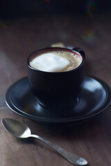 Coffee with milk on dark wooden background. Close up.	