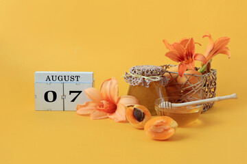 Calendar for August 7 : the name of the month of August in English, cubes with the numbers 0 and 7,...