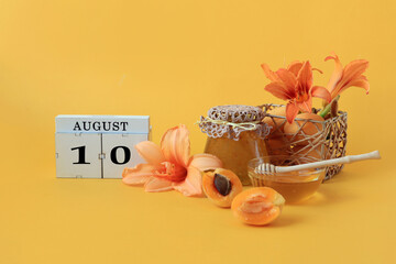 Calendar for August 10 : the name of the month of August in English, cubes with the number 10,...