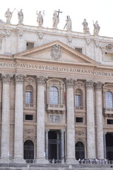 Fototapeta na wymiar St Peter's Basilica Facade Detail with Columns and Sculptures in Rome, Italy