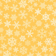 Christmas seamless pattern with complex big and small snowflakes, white on yellow background