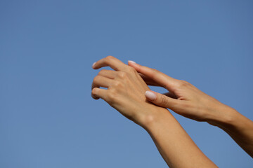 Fototapeta na wymiar hands on sky. Sensual woman hands. Concept. Photo. 