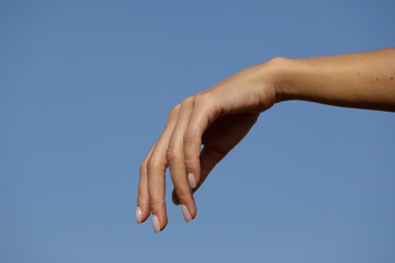 Sensual woman hand. hands in the sky. Idea. Background. 