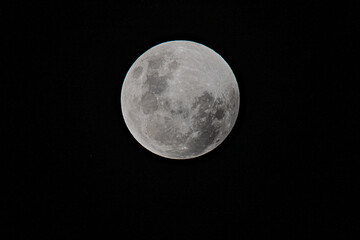 Full moon lunar eclipse on May 26 2021 at Killcare Beach, NSW, Australia. A Super Moon, a Blood Moon, also known as the Flower Moon and the Lunar Eclipse.