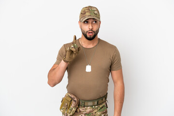 Young arab soldier man isolated on white background thinking an idea pointing the finger up