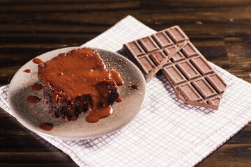 individual chocolate brownie dessert on wooden background
