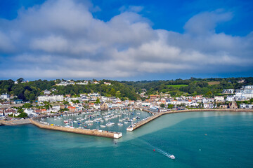 Aerial drone image of St Aubn's Harbour and Village at high tide in the sunshine. Jersey Channel...