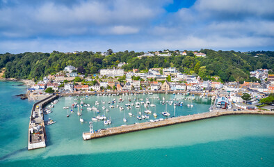 Aerial drone image of St Aubn's Harbour and Village at high tide in the sunshine. Jersey Channel Islands - obrazy, fototapety, plakaty