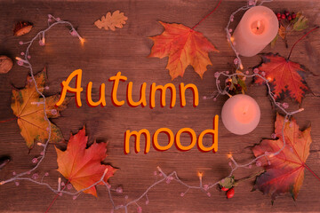 beverage, hot drink in a mug, leaves, foliage, garland, candles, top view of wooden table, good...