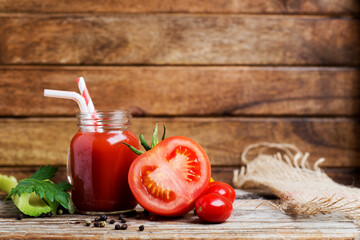 Sliced juicy tomato and tomato juice with celery