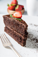 Fototapeta na wymiar chocolate cake with strawberries on a silver platter
