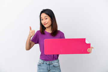 Young Vietnamese woman isolated on white background holding an empty placard with thumb up