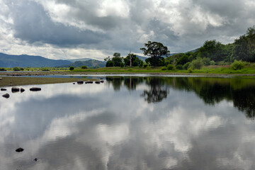 Bassenthwaite Lake surrounded by hills on a cloudy summer afternoon, Lake district, England
