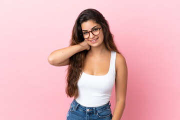 Young caucasian woman isolated on pink background laughing