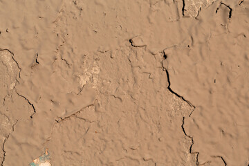 Old wall covered with plaster dark shades.
