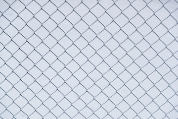 frozen mesh fence close-up