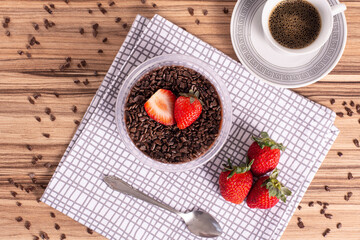 brigadeiro pot cake with strawberry on wooden background