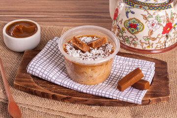 dulce de leche cake on wooden background