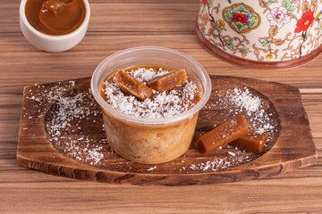 dulce de leche cake on wooden background