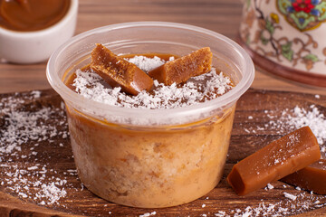 dulce de leche cake on wooden background