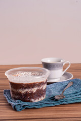 coconut and chocolate pot cake on wooden background