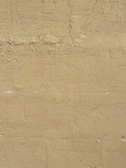 old yellow plastered wall background