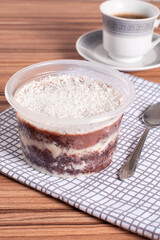 coconut and chocolate pot cake on wooden background