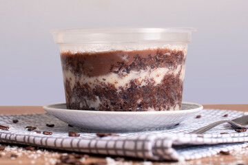 coconut and chocolate pot cake on wooden background