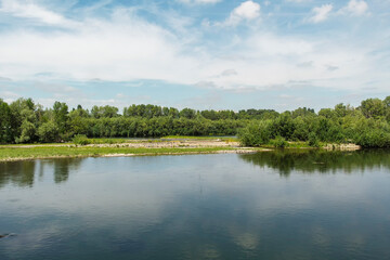Obraz na płótnie Canvas Ulba river with green trees on the banks. Green forest. River landscape. Ust-Kamenogorsk, (kazakhstan)