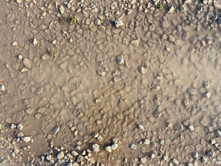 old crushed stone road texture background closeup