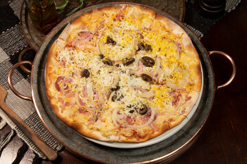 Brazilian Portuguese-style pizza with ham, egg, pepper, onion, mozzarella