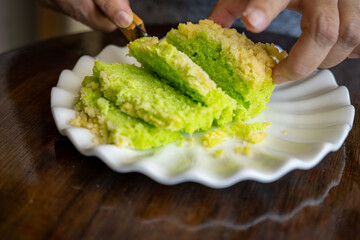 Pandan green cake with butter crumbs.