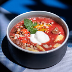 Water melon with banana oat smoothie in a bowl on table