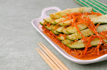 Fermented cucumbers with carrots and spices.