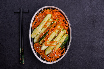 Fermented cucumbers with carrots and spices.