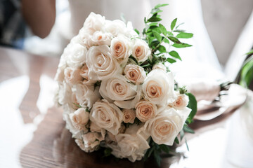 Obraz na płótnie Canvas classic wedding bouquet of the bride in bright colors white roses and greenery