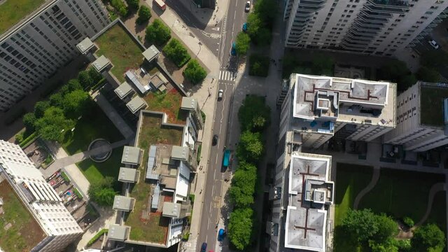 Top down view of modern housing estate. Flying above buildings with green roofs. Ecology and sustainable life in city