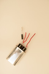 Top-down shot of electronics components isolated against a whitish background. 