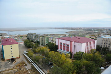 Fototapeta premium Zhezkazgan, Kazakhtan - 10.10.2016 : Residential buildings, commercial buildings and courtyards along the central streets of the city.