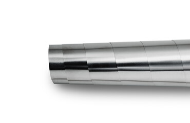 Rolled shiny metal plates laid on a white background.
