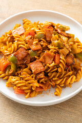 fusilli pasta with ham and tomatoes sauce
