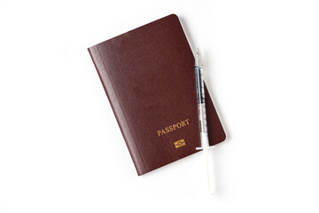 Passport with medical vaccine drug syringe needle dose. Vaccination passport is concept of immune travel to protect from Covid-19 virus pandemic on white background