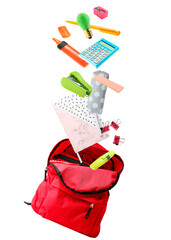 Flying backpack with school supplies on white background