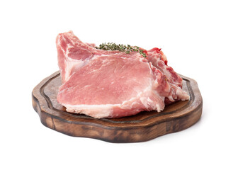 Board with slices of raw pork ribs and thyme on white background