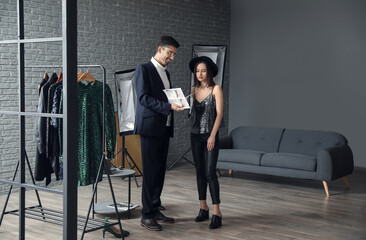 Male stylist working with model in studio